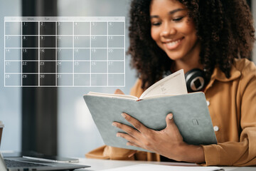 Business woman using digital tablet with calendar planner and organizer to plan and reminder,...