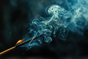 A matchstick with smoke coming out of it. Can be used to illustrate concepts such as danger, fire, ignition, or smoking