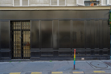 typical french boutique  facade, parisian black painted storefront template