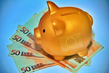 Piggy bank with European banknotes.Piggy bank with European banknotes with the European flag.