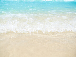 Travel Sea Nature Concept, Shore Sand Water Blue Ocean blur Background, View Calm Texture Wave Surface Beach with Horizon, Island Beautiful Landscape for Card Tourism Holidays Vacation Relax Tropical.