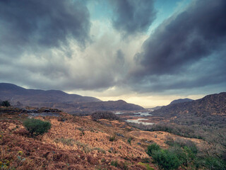 Stunning nature scene with mountains and dark dramatic sky. Ladies view, Killarney, Ireland, ring of Kerry route. Magnificent Irish nature and popular travel and tourist area.