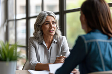 Fototapeta premium Professional therapists conduct an open group session and a comforting smile, emphasizing the importance of mental health and counseling.