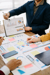 Business People Planning Strategy Analysis Office Concept. writing notes about sticky notes Laptop,tablet  Planning and Brainstorming Strategies