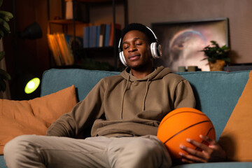Moment of relaxation basketball player taking break from rigorous training schedule simply enjoying...