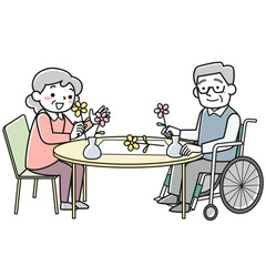 フラワーアレンジメントを楽しむシニアの男女