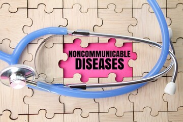 wooden puzzle and stethoscope with the word Noncommunicable diseases