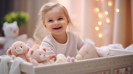 Fototapeta premium A cute little 1-2 year old baby with blonde hair is standing in a crib and laughing. Happy childhood. Kids's emotions