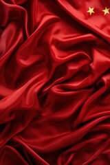 Obraz premium Red silk fabric with golden stars