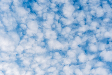 cloudy sky background for wallpaper and design, day skyscape with white beautiful clouds and blue...