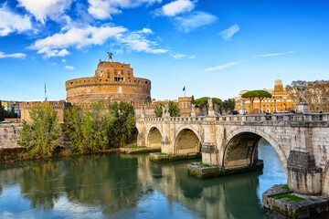 Castel Sant'Angelo and the Sant'Angelo bridge  over Tiber river during sunny day in Rome, Italy. - obrazy, fototapety, plakaty