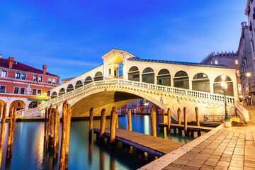 Famouse Rialto Bridge of Venice on the Grand Canal at twilight, Italy.