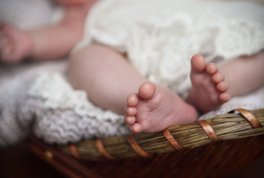 Close up of tiny baby feet. Toes. Horizontal photo. Macro.
