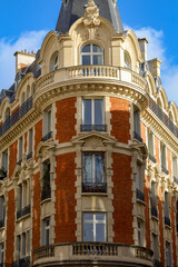 Fototapeta na wymiar real estate , haussmannian architecture in Paris , red bricks facade