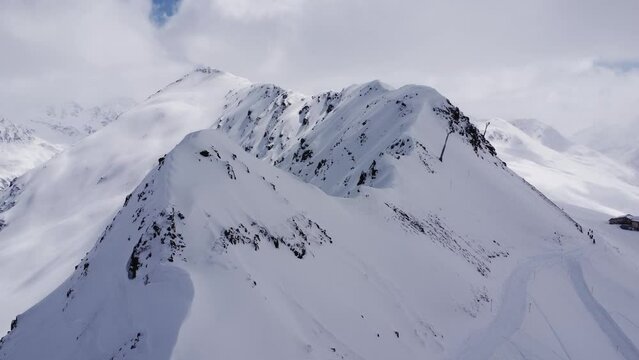 High altitude ski station building surrounded by clouds in the Swiss Alps