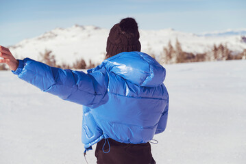 Beautiful woman with warm blue jacket walking in the winter mountain .Vitosha ,Bulgaria 