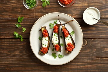 Roasted aubergine with yogurt and tomato sauce dressing