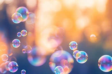 iridescent transparent soap bubbles on a blurred nature background