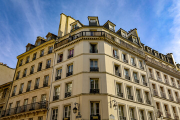 typical parisians building facade , haussmannian style  4th arrondissement