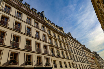 typical parisians building facade , haussmannian style  4th arrondissement