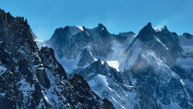 Aerial Panning Scenic View Of Tranquil Snowcapped Mountains On Sunny Day - French Alps, France