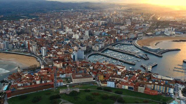 Drone point of view Gijon or Xixon city in north-western Spain during sunset, coast of Cantabrian Se, Bay of Biscay, in the central-northern part of Asturias. Travel destinations, landmarks concept