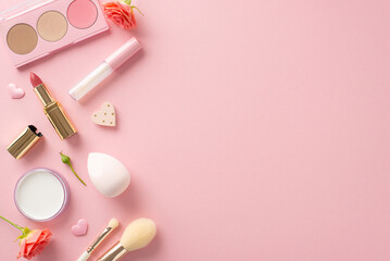 Obraz na płótnie Canvas Sweet gestures: Cosmetics galore! Lipstick, lip gloss, eyeshadow palette, highlighter, brushes and more. Top view on pastel pink with fresh roses and hearts. Create magic with this Valentine's gift
