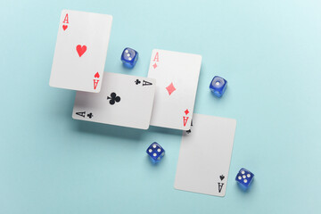 Four aces and dice on a blue background