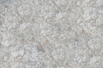 The texture of the plaster on the wall, rough strokes made with a palette knife, paint on the surface, abstract background for design.