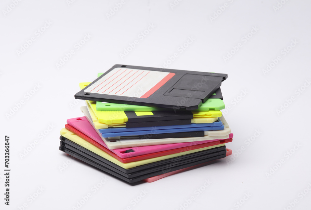 Aufkleber stack of colored floppy disks on white background