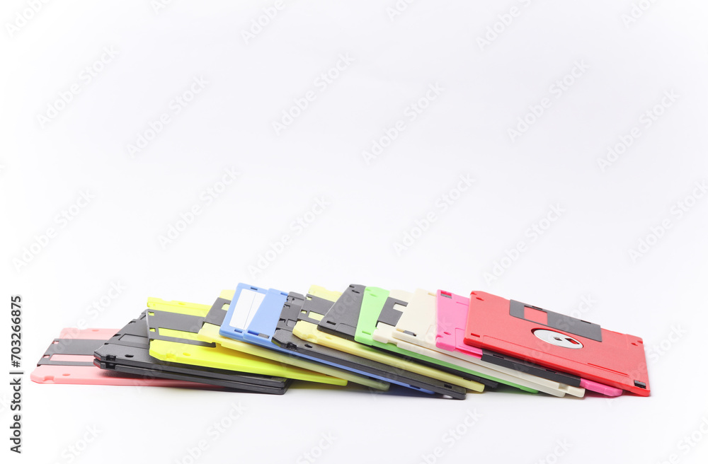 Aufkleber stack of colored floppy disks on white background