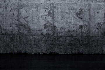 Grungy dark concrete wall and wet floor