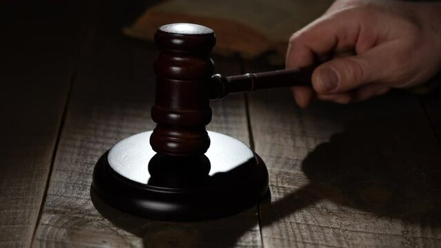 Wooden judge gavel and soundboard on the wooden table background, close up