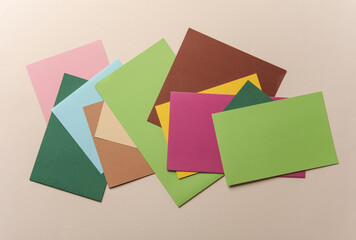 Many colored blank cards sheet on beige background.