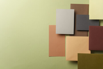 Group of floating colored blank cards sheet with shadow on green background. Minimalism business brand template, creative layout