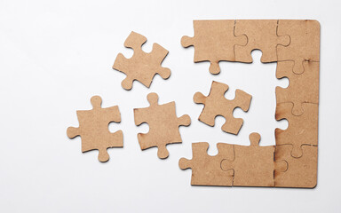 Wooden pieces jigsaw puzzle on white background