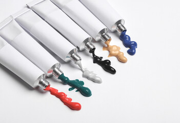 Set of White tubes of acrylic or oil paint for creativity on white background. Template for design, mockup