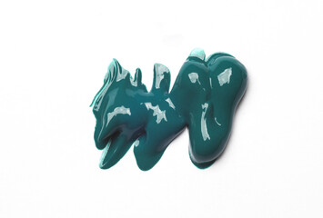Samples of turquoise acrylic or oil paint on a white background