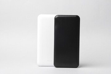 Black and White power banks on a gray background. External battery