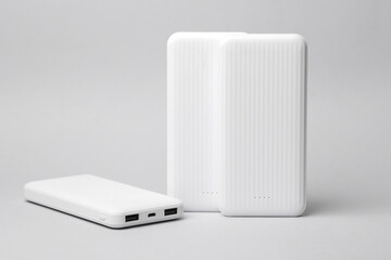 White power banks on a gray background. External battery
