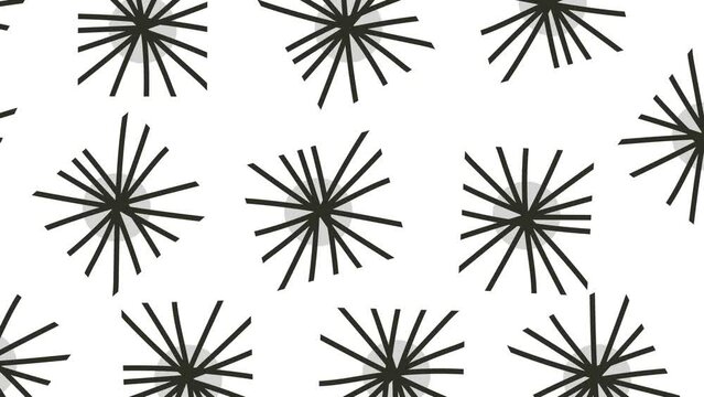 Snowflakes or sea urchins move across the screen