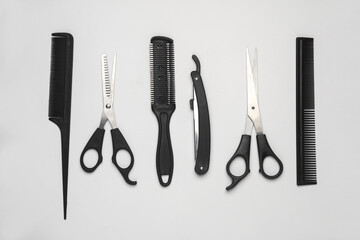 Hair cutting scissors and straight razor, cjmbs on a white background. Barber's working tools