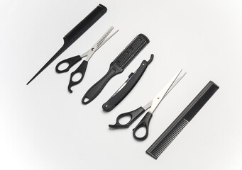 Hair cutting scissors and straight razor, cjmbs on a white background. Barber's working tools