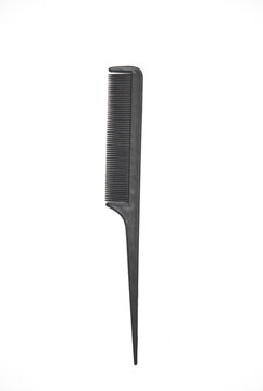 Black plastic comb for haircuts on a white background