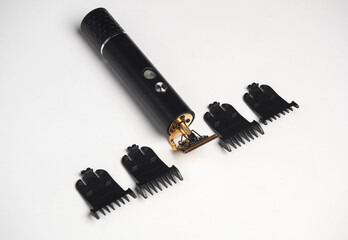 Beard trimmer with attachments on a white background