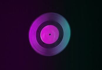 Vinyl record isolated on black background in neon light