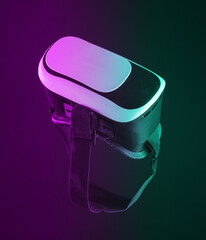 Virtual reality helmet, vr glasses isolated on black background in neon light
