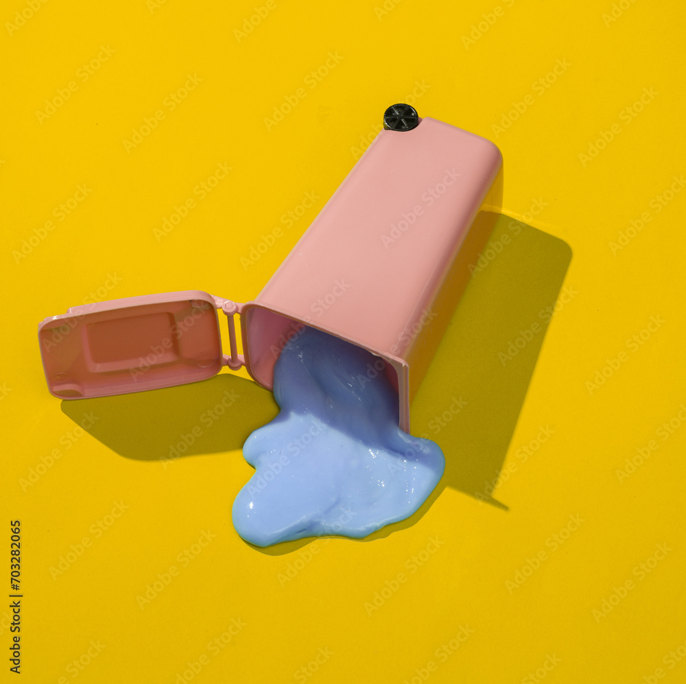 Poster creative minimalist layout. trash can with slime on a yellow background. surreal summer idea. concep