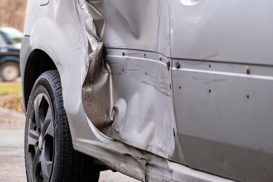 A crumpled car door after an accident. Broken car