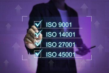 ISO standards concept with businessman tick checkmark on the box of industrial systems requirement...